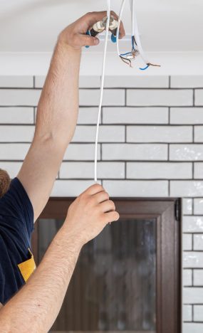 electrician-builder-at-work-installation-of-lamps-2023-11-27-05-08-03-utc